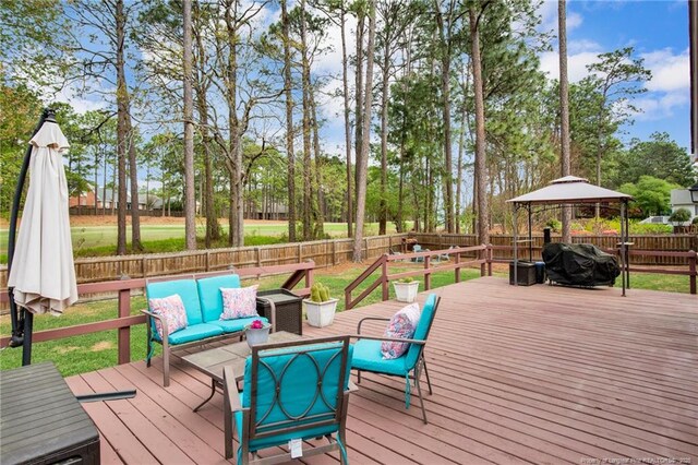 6868 Uppingham Rd, Fayetteville, NC 28306 - wooden terrace with grilling area, a gazebo, outdoor lounge area, and a fenced backyard