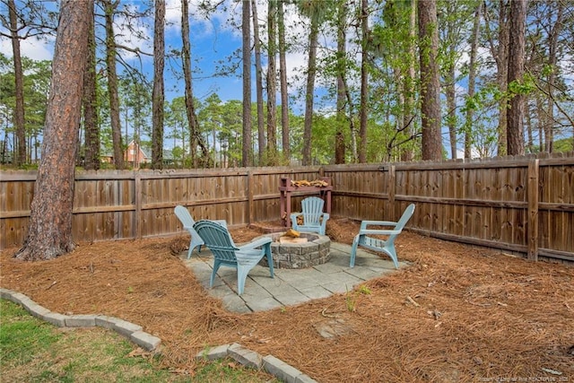 6868 Uppingham Rd, Fayetteville, NC 28306 - view of yard featuring a fire pit, a fenced backyard, and a patio area