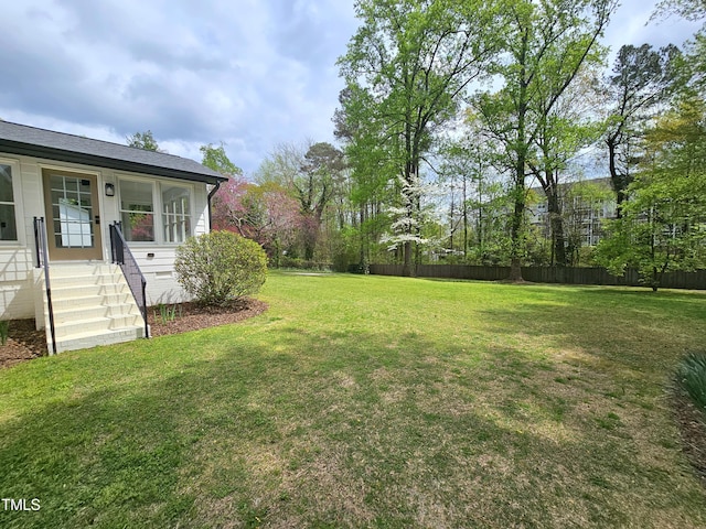 view of yard featuring fence