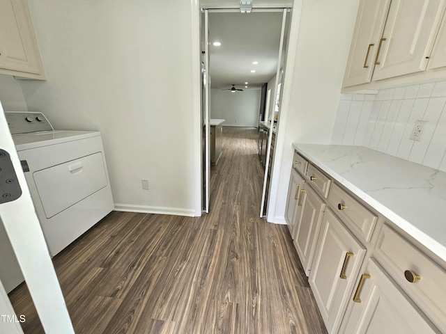 laundry room featuring separate washer and dryer, ceiling fan, baseboards, and dark wood finished floors
