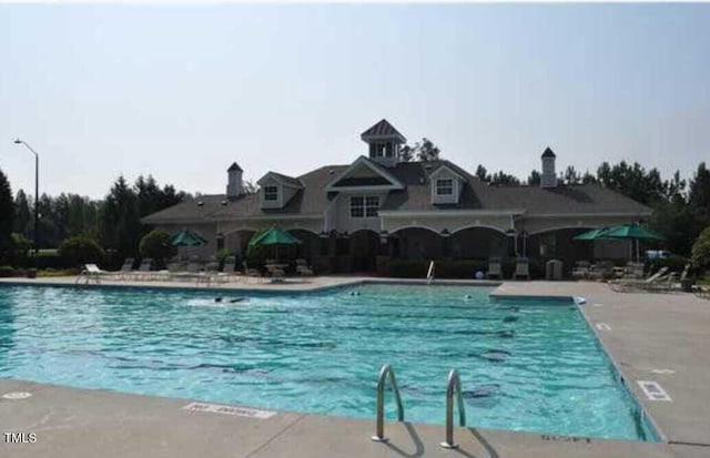 1008 Garden Square Ln, Morrisville, NC 27560 - community pool featuring a patio
