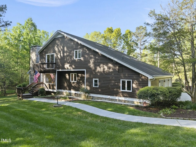 back of house with a yard and a chimney