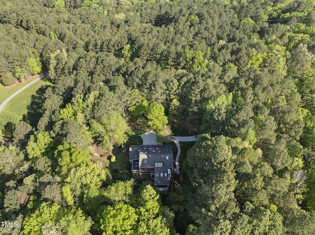 aerial overview of property's location featuring a forest