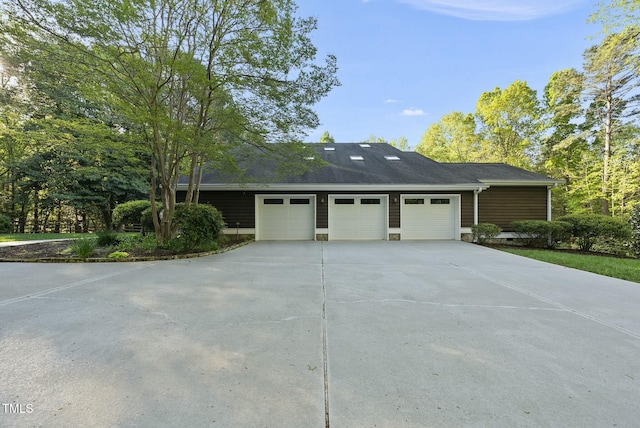view of front of property featuring an attached garage and driveway