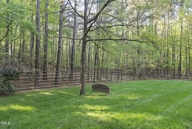 view of yard with a view of trees
