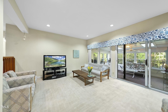living area with carpet, recessed lighting, a ceiling fan, and baseboards