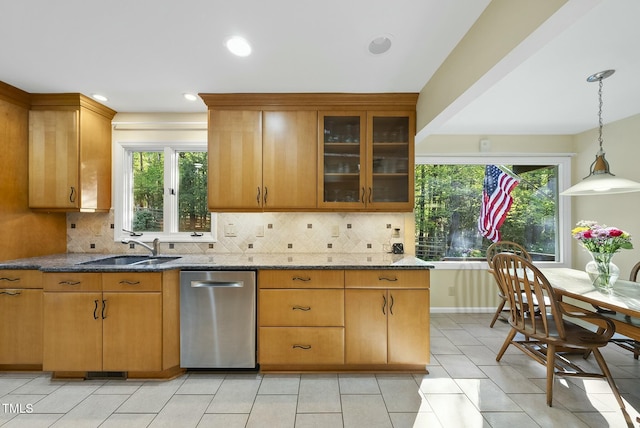 kitchen with dishwasher, a sink, decorative backsplash, stone countertops, and recessed lighting