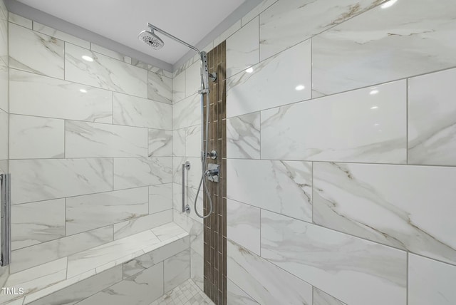full bathroom featuring tiled shower
