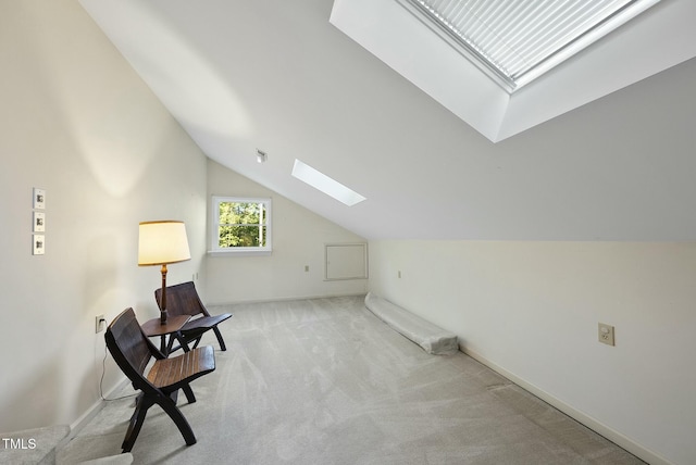 bonus room featuring a skylight, vaulted ceiling, carpet floors, and baseboards