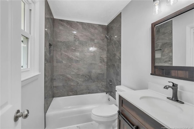 bathroom with toilet, vanity, and bathing tub / shower combination