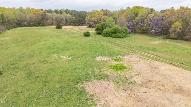 aerial view featuring a wooded view