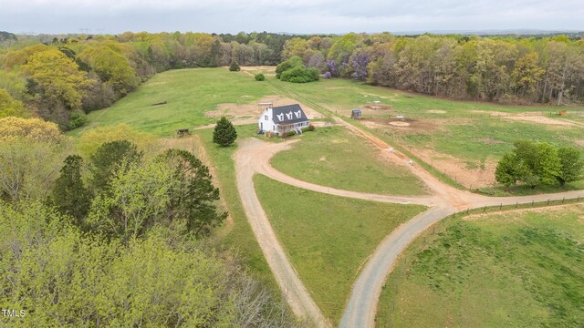 birds eye view of property with a rural view and a forest view