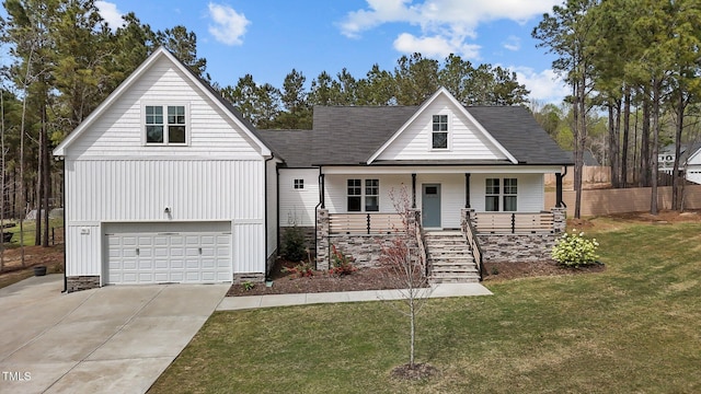 381 Heart Pine Dr, Wendell, NC 27591 - view of front of home featuring stairs, a garage, a front lawn, driveway, and a porch