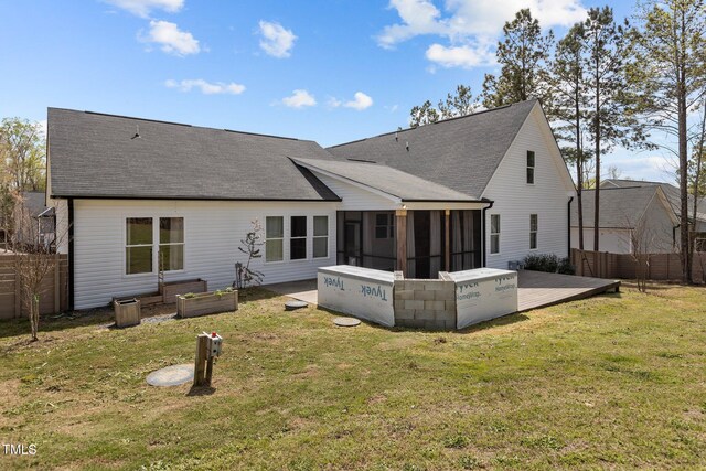 381 Heart Pine Dr, Wendell, NC 27591 - rear view of property with a lawn, a sunroom, fence, and roof with shingles