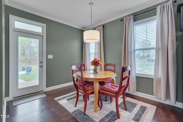 dining space featuring ornamental molding and a wealth of natural light
