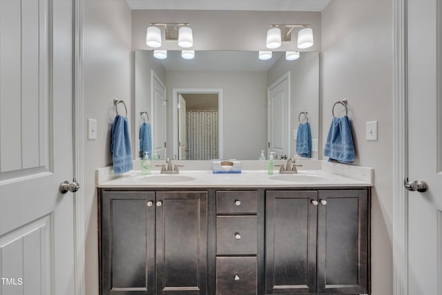 full bathroom with a sink and double vanity
