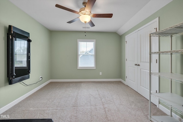 unfurnished bedroom featuring visible vents, baseboards, a closet, ceiling fan, and carpet flooring