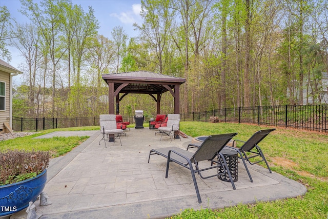 view of patio featuring a gazebo and a fenced backyard