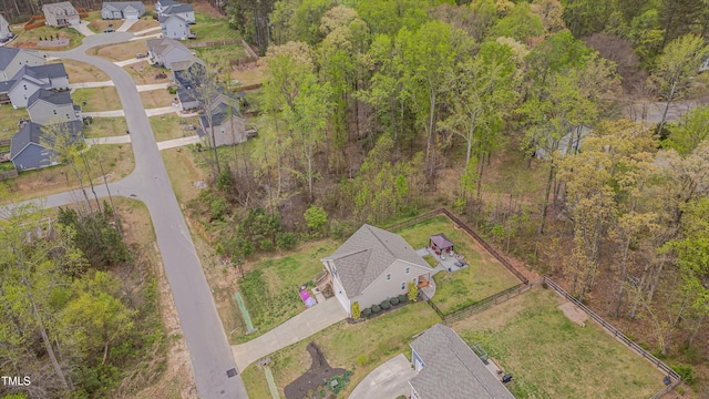 bird's eye view featuring a view of trees and a residential view