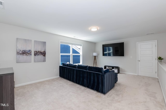 living room with carpet and baseboards