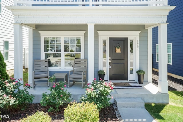entrance to property featuring covered porch