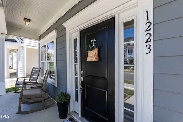 doorway to property with a porch