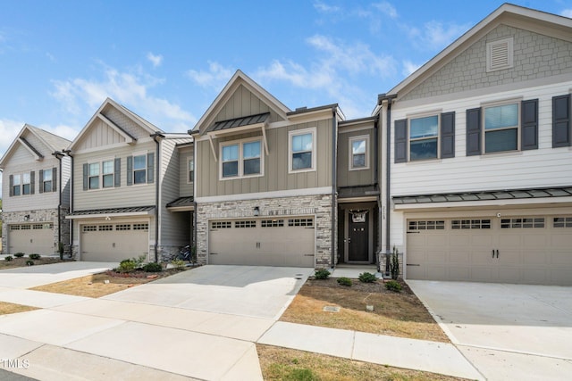 2129 Mars Hill Ln, Apex, NC 27502 - view of property featuring driveway, board and batten siding, stone siding, an attached garage, and a standing seam roof