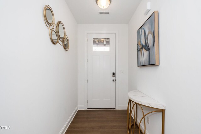 2129 Mars Hill Ln, Apex, NC 27502 - doorway with visible vents, baseboards, and dark wood finished floors
