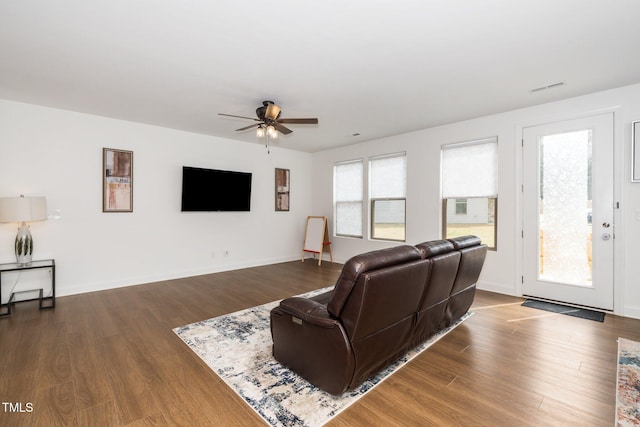 2129 Mars Hill Ln, Apex, NC 27502 - living area with visible vents, ceiling fan, wood finished floors, and baseboards