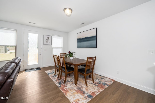 2129 Mars Hill Ln, Apex, NC 27502 - dining area with visible vents, baseboards, and dark wood-style floors