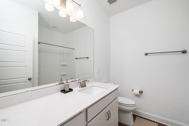 2129 Mars Hill Ln, Apex, NC 27502 - bathroom featuring vanity, visible vents, a shower, toilet, and baseboards