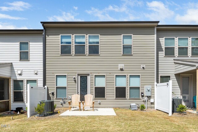 2129 Mars Hill Ln, Apex, NC 27502 - back of house featuring a yard, central AC unit, and a patio