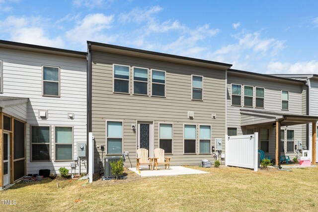 2129 Mars Hill Ln, Apex, NC 27502 - rear view of house with a yard, a patio, and central AC