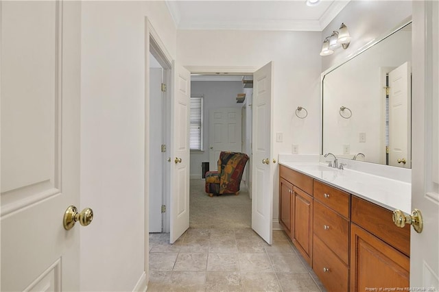 bathroom featuring ensuite bath, ornamental molding, and vanity
