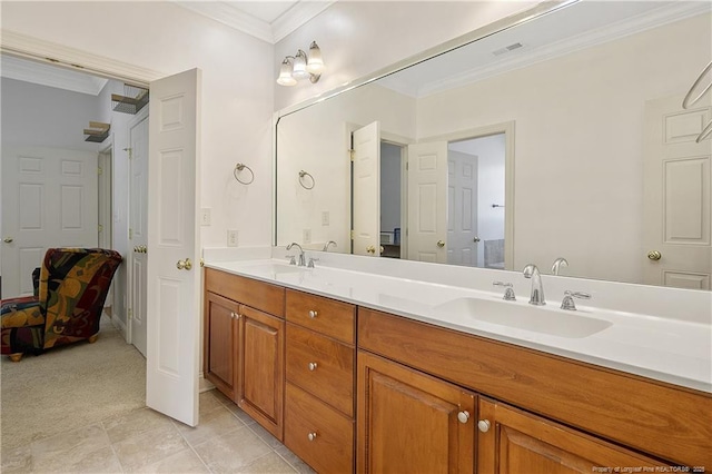 bathroom with double vanity, a sink, ornamental molding, and visible vents