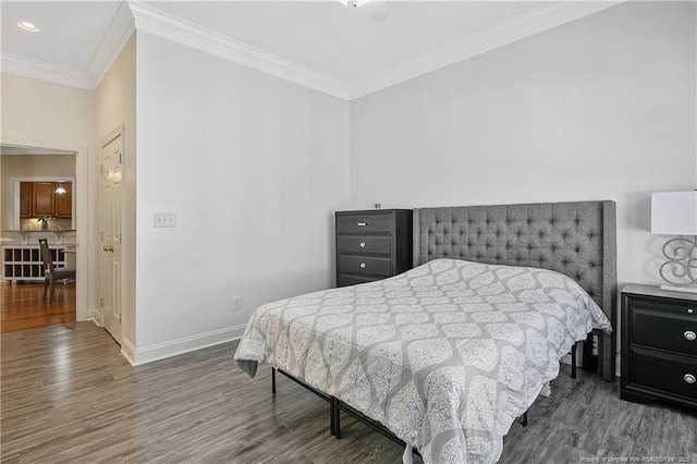 bedroom featuring recessed lighting, crown molding, baseboards, and wood finished floors