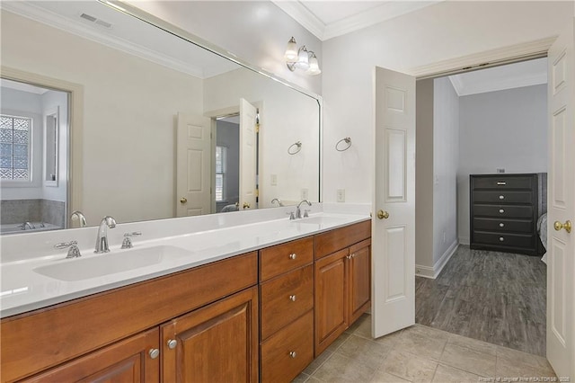 full bath featuring visible vents, a sink, double vanity, and crown molding