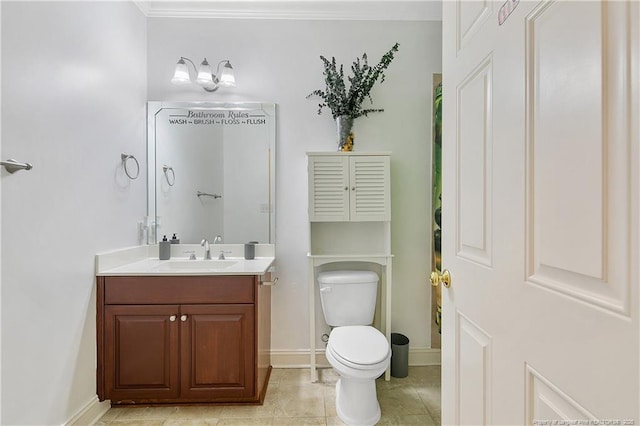 bathroom with tile patterned floors, toilet, baseboards, and vanity