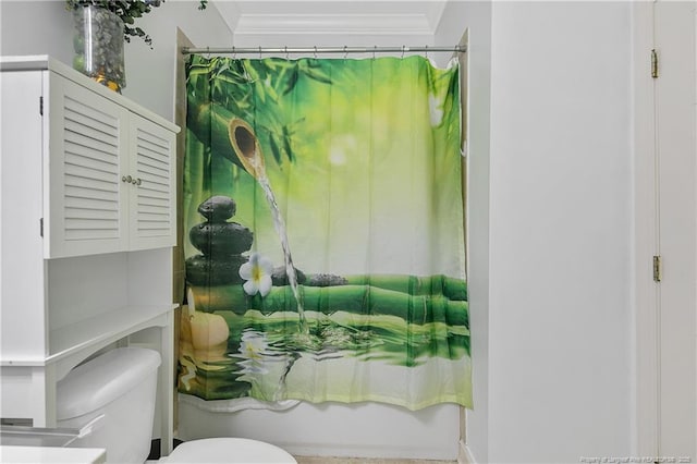 bathroom featuring shower / bath combination with curtain, toilet, and crown molding