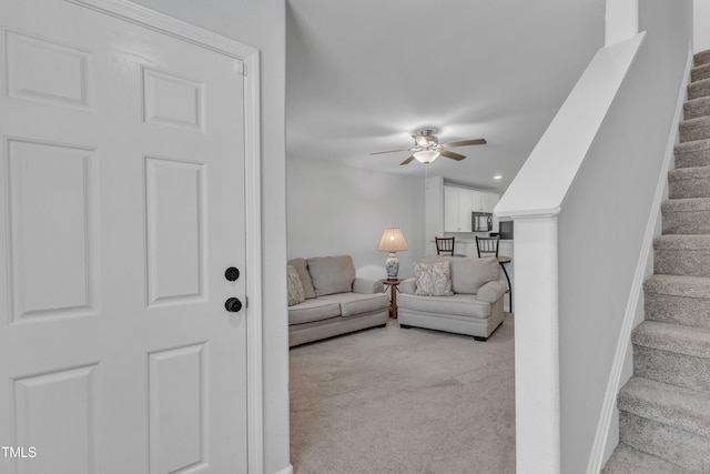 918 E Green St Unit F105, Franklinton, NC 27525 - living area featuring stairway, ceiling fan, light carpet, baseboards, and recessed lighting