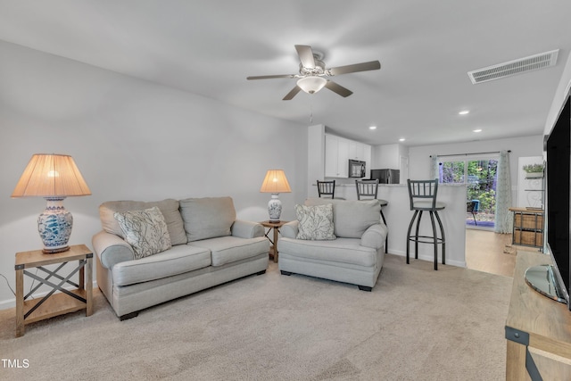918 E Green St Unit F105, Franklinton, NC 27525 - living area featuring ceiling fan, light colored carpet, baseboards, visible vents, and recessed lighting
