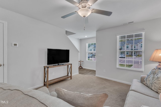 918 E Green St Unit F105, Franklinton, NC 27525 - living area with baseboards, a ceiling fan, visible vents, and carpet