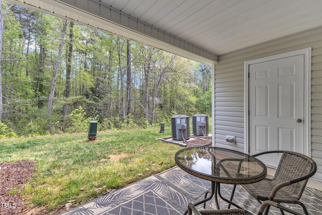 918 E Green St Unit F105, Franklinton, NC 27525 - view of patio / terrace with a view of trees and cooling unit