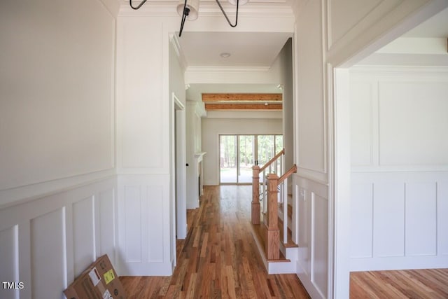 1212 Perry Bluff Dr, Wake Forest, NC 27587 - hall featuring a decorative wall, ornamental molding, wood finished floors, and a chandelier