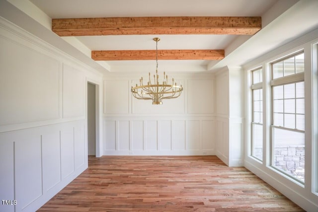 1212 Perry Bluff Dr, Wake Forest, NC 27587 - unfurnished dining area with a decorative wall, a chandelier, light wood-style flooring, and beamed ceiling