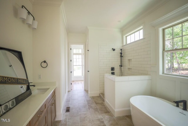 1212 Perry Bluff Dr, Wake Forest, NC 27587 - bathroom with a walk in shower, a freestanding bath, vanity, and ornamental molding