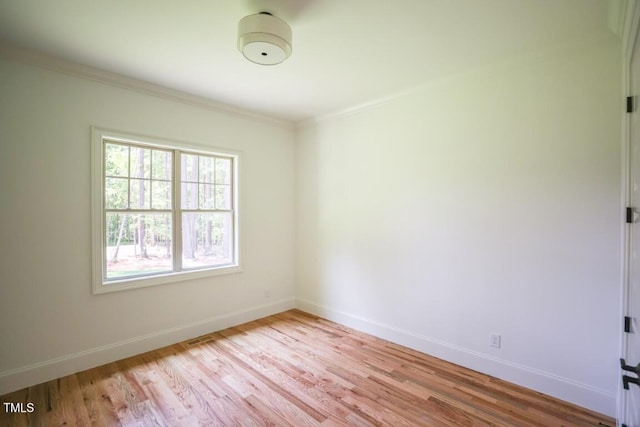 1212 Perry Bluff Dr, Wake Forest, NC 27587 - spare room featuring light wood-style floors and crown molding