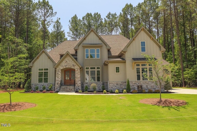 1212 Perry Bluff Dr, Wake Forest, NC 27587 - craftsman-style home with board and batten siding, stone siding, a front lawn, and a shingled roof