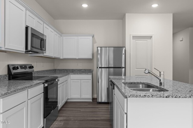 825 Kenyon Spring Dr, Zebulon, NC 27597 - kitchen featuring a sink, an island with sink, white cabinetry, and stainless steel appliances