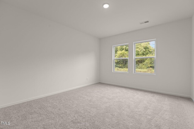 825 Kenyon Spring Dr, Zebulon, NC 27597 - carpeted spare room with baseboards and visible vents